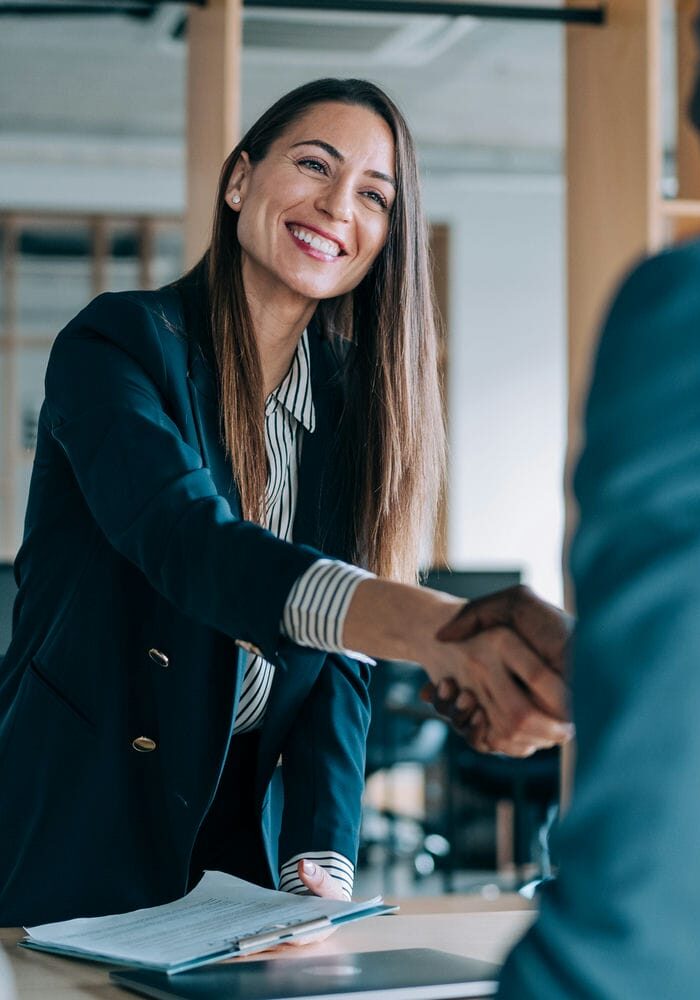 Litigation team meeting with a life care planning consultant in a modern office